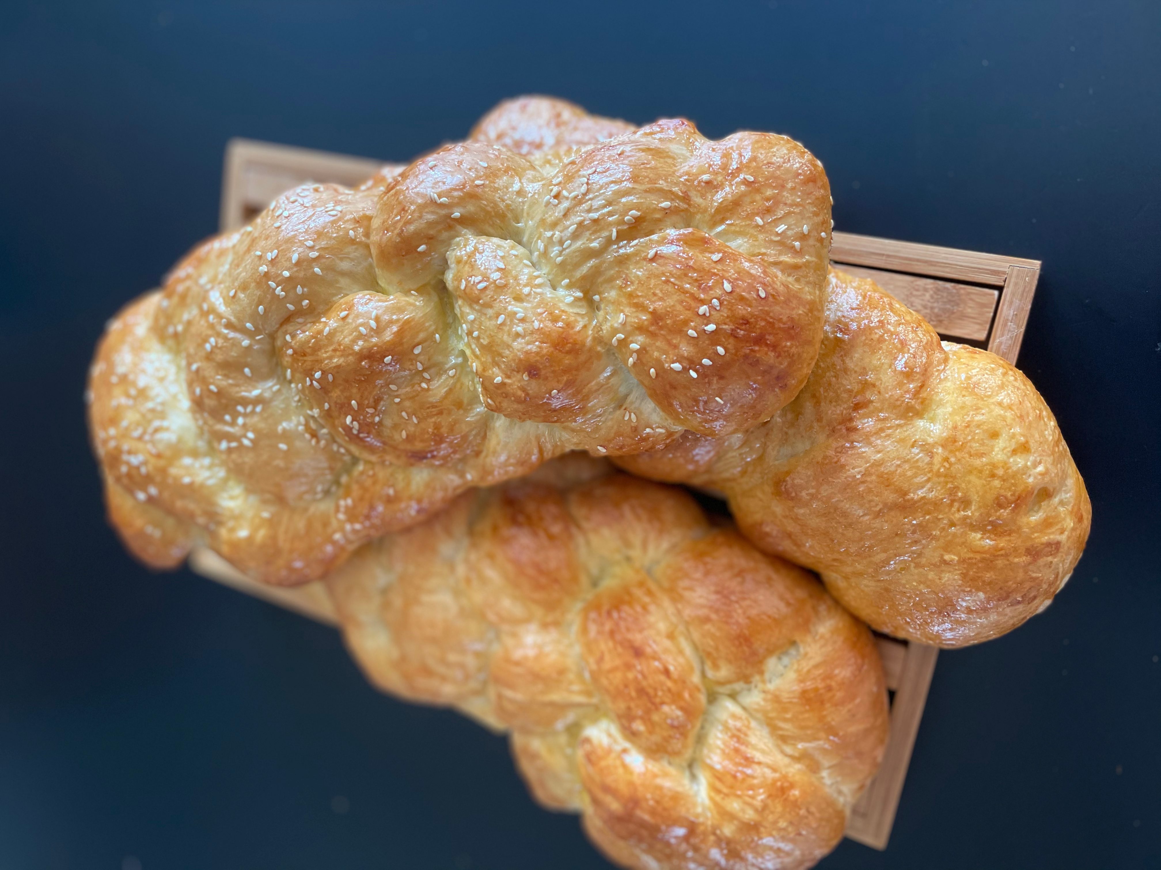homemade sesame challah in a 3-braid