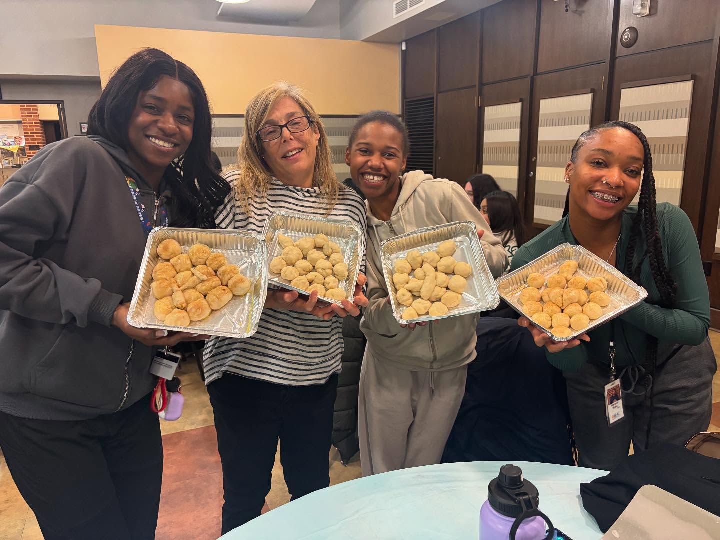 Class participants holding pull-apart dreidels they made